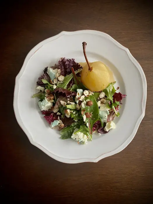 Cider Poached Pears with Greens, Blue Cheese, Toasted Hazelnuts and Cider Reduction Vinaigrette